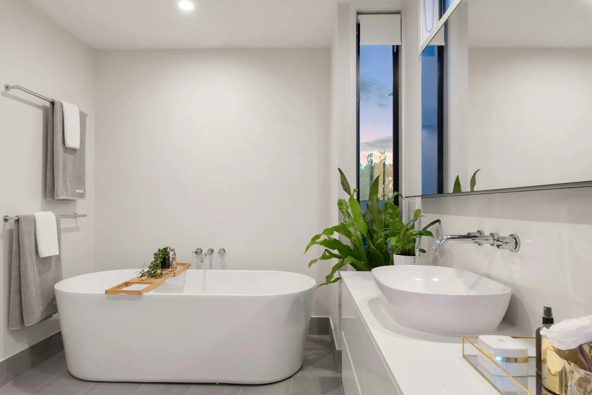 Bright remodeled bathroom with walk-in shower and new vanity