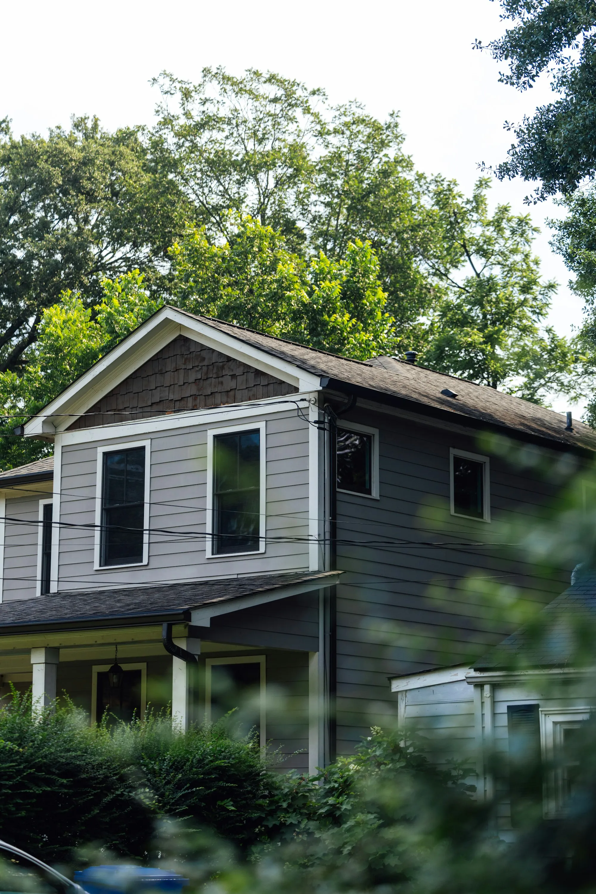 Small detached backyard cottage with its own front porch