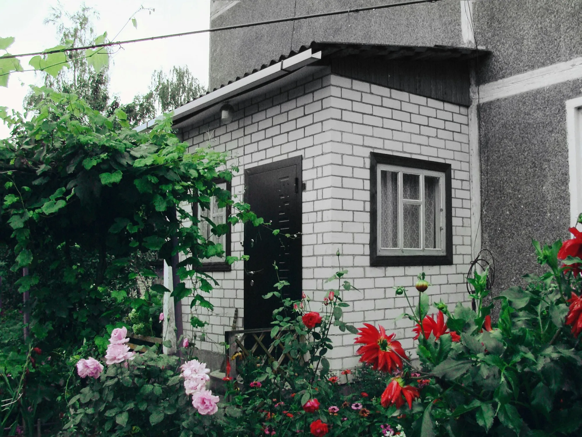 Converted garage ADU with a new entry door and windows