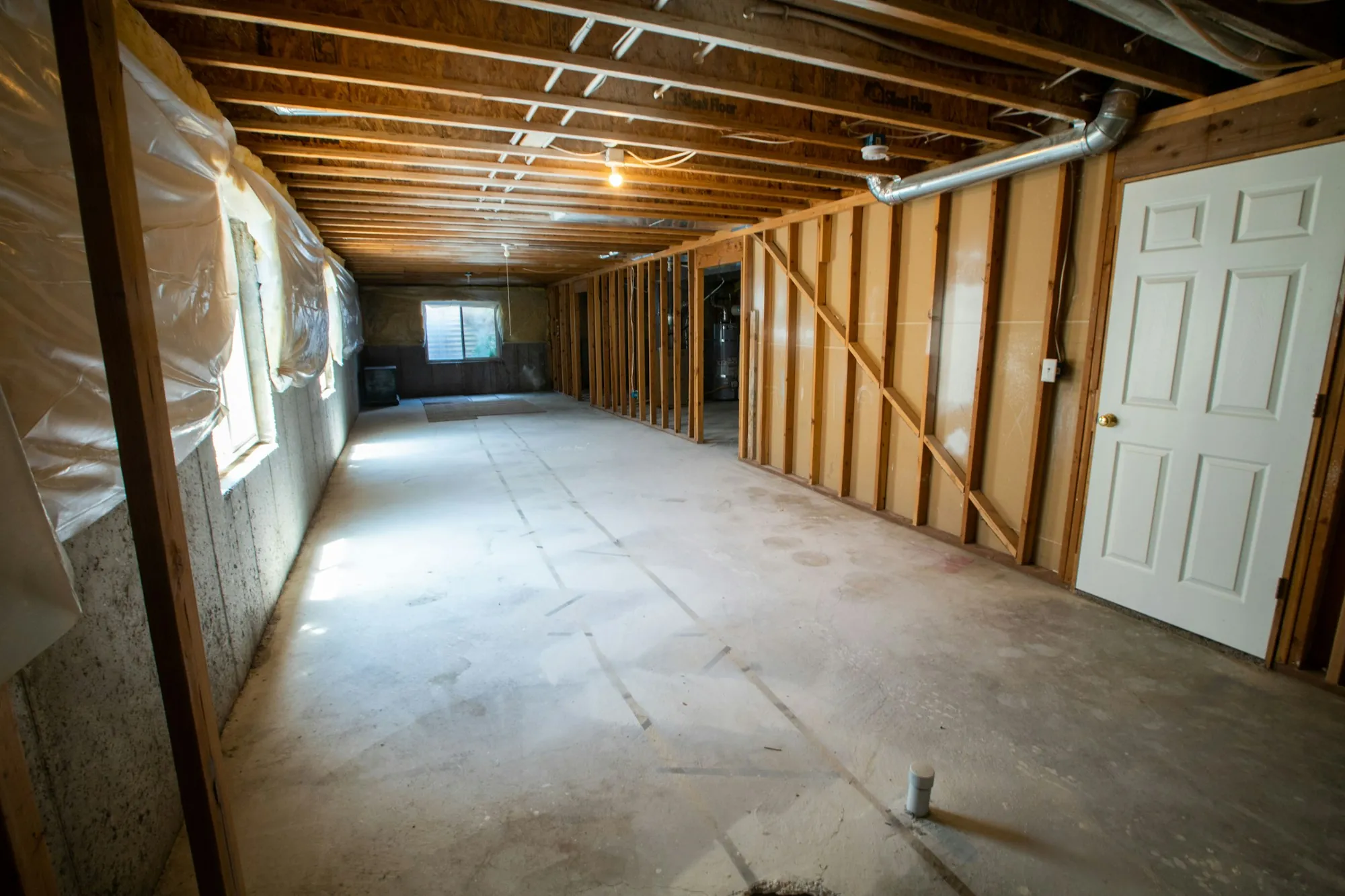 Newly finished basement with a home office corner and guest area